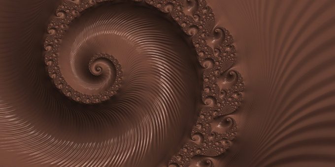 Dunklere Schokoladenmasse mit Spiralmuster